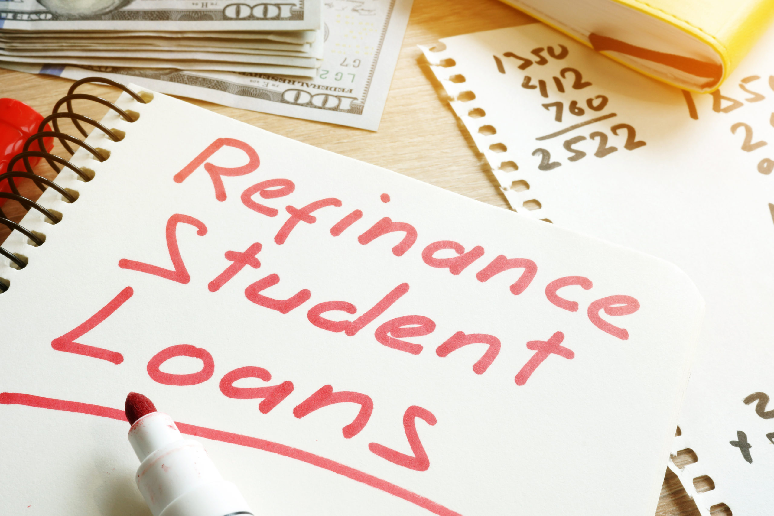 Refinance Student Loans form on a desk.